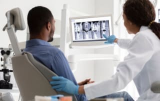 Best dentist in Boston MA | patient reviewing x-rays